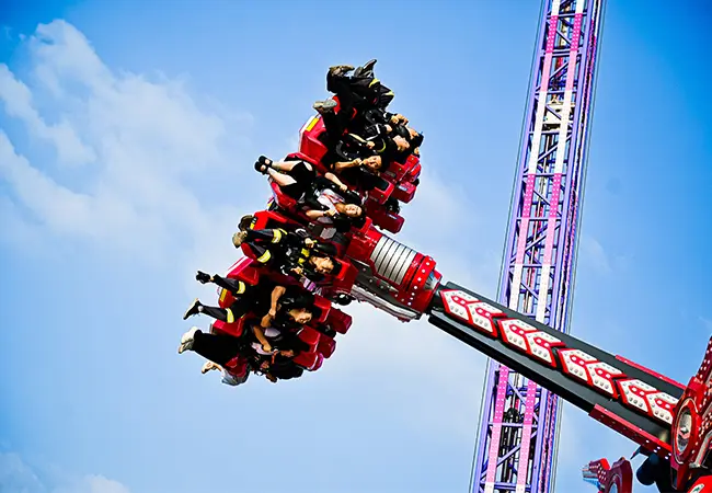 Riders Experiencing Weightlessness on Pendulum Ride